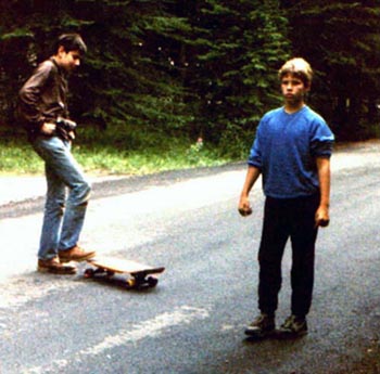 Tommy and Joel with skateboard.